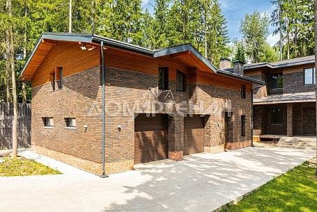 Купить коттедж в КП 10888 Рожновка. Современный коттедж на лесном участке